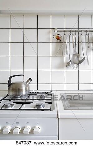 Detail of a stove and sink in a kitchen View Large Photo Image Stock Photo - Detail of a stove and sink in a kitchen. Fotosearch