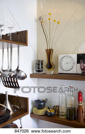 Detail of household items on kitchen shelves View Large Photo Image Stock Photograph - Detail of household items on kitchen shelves. Fotosearch