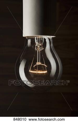 An illuminated light bulb, extreme close-up View Large Photo Image Stock Image - An illuminated light bulb, extreme close-up. Fotosearch