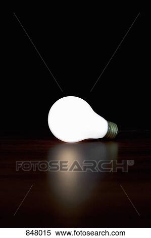 Stock Photography - An illuminated light bulb. Fotosearch