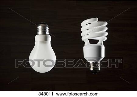 Two different light bulbs View Large Photo Image Stock Image - Two different light bulbs. Fotosearch