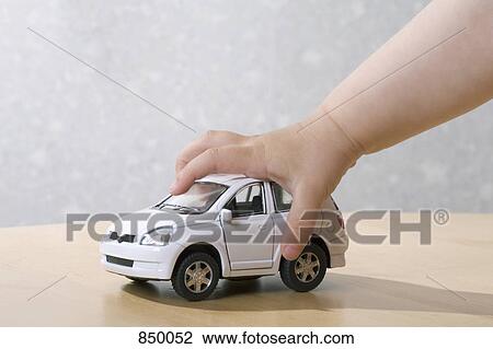 A child playing with a toy car View Large Photo Image Stock Image - A child playing with a toy car. Fotosearch