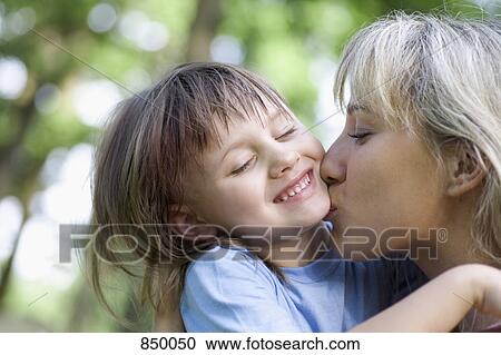 A mother and daughter kissing View Large Photo Image Stock Image - A mother and daughter kissing. Fotosearch