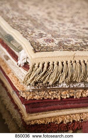 A pile of rugs View Large Photo Image Stock Photograph - A pile of rugs. Fotosearch