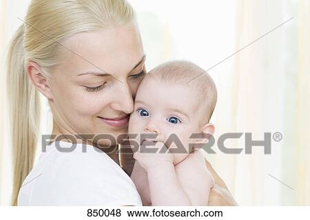 Portrait of a mother and baby daughter View Large Photo Image Stock Photo - Portrait of a mother and baby daughter. Fotosearch