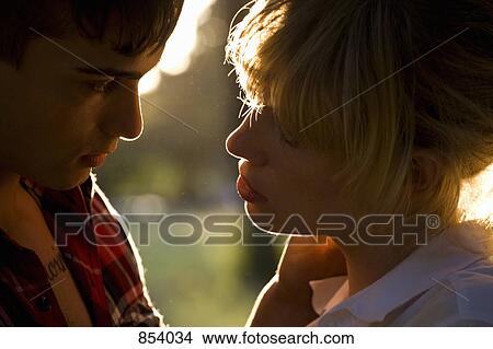 A passionate young couple face to face, extreme close up View Large Photo Image Picture - A passionate young couple face to face, extreme close up. Fotosearch
