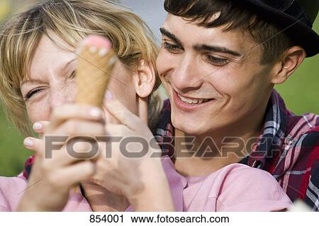 Stock Image - A young couple laughing. Fotosearch