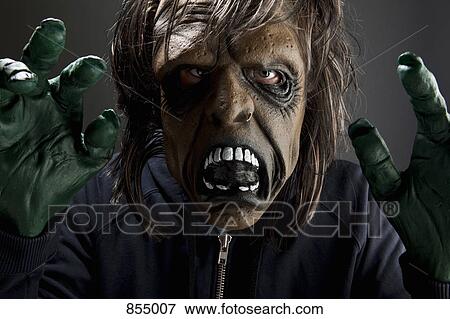 Stock Photo - A person wearing a spooky disguise. Fotosearch