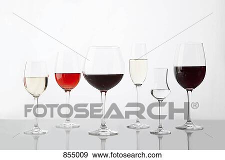 A row glasses containing various wines View Large Photo Image Stock Photo - A row glasses containing various wines. Fotosearch