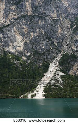 Stock Photograph - Detail of a lake below mountains, Braies Lake, South Tyrol, Italy. Fotosearch