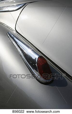 Stock Image - Detail of a tail light on an old-fashioned car. Fotosearch