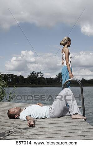 A couple relaxing on a health spa jetty View Large Photo Image Picture - A couple relaxing on a health spa jetty. Fotosearch