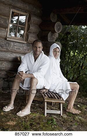 A couple relaxing outside the sauna at a health spa View Large Photo Image Stock Photo - A couple relaxing outside the sauna at a health spa. Fotosearch