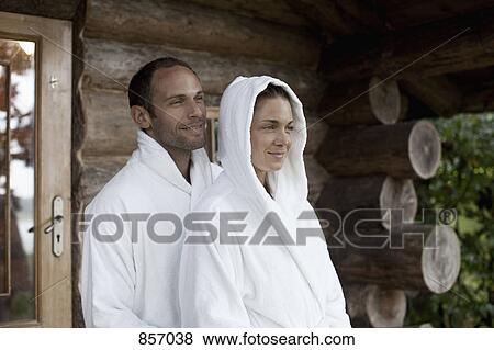 A couple relaxing outside the sauna at a health spa View Large Photo Image Stock Photo - A couple relaxing outside the sauna at a health spa. Fotosearch