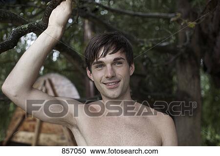 A wet man holding onto a branch, hot tub in background View Large Photo Image Stock Image - A wet man holding onto a branch, hot tub in background. Fotosearch