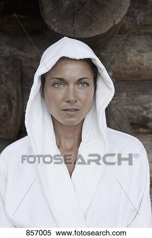 A woman in a hooded bathrobe staring off camera View Large Photo Image Stock Photography - A woman in a hooded bathrobe staring off camera. Fotosearch