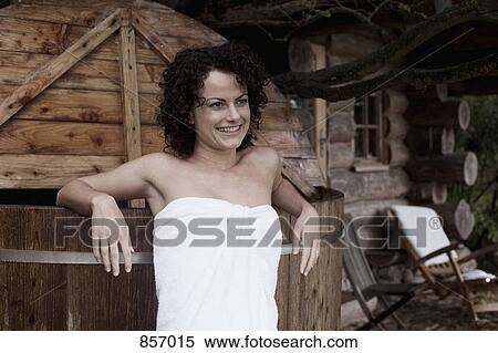 A woman leaning against an outdoor hot tub at a health spa View Large Photo Image Stock Photography - A woman leaning against an outdoor hot tub at a health spa. Fotosearch