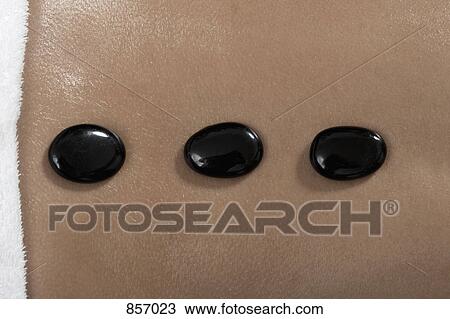 A woman receiving hot stone Therapy View Large Photo Image Stock Image - A woman receiving hot stone Therapy. Fotosearch