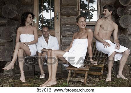 Four people relaxing outside the sauna at a health spa View Large Photo Image Stock Image - Four people relaxing outside the sauna at a health spa. Fotosearch