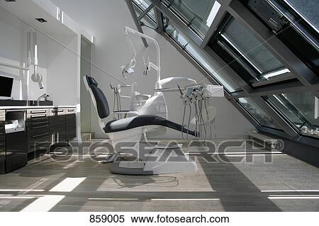 Stock Photography - An empty chair in a dental examination room. Fotosearch