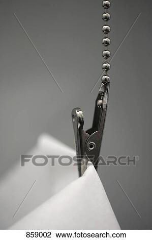 Detail of a metal clip holding a dental bib View Large Photo Image Stock Image - Detail of a metal clip holding a dental bib. Fotosearch