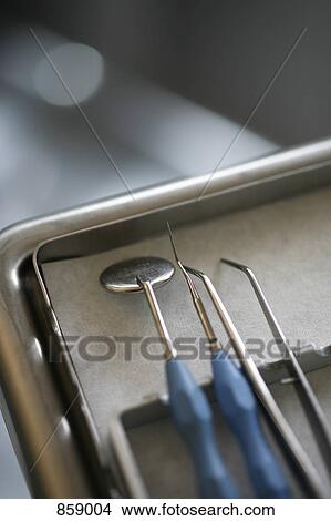 Picture - Detail of dental instruments on a tray . Fotosearch