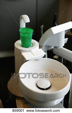 High angle view of a plastic cup at the edge of a dental cuspidor View Large Photo Image Stock Image - High angle view of a plastic cup at the edge of a dental cuspidor. Fotosearch