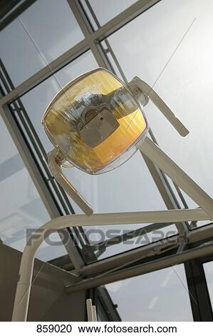 Low angle view of a light in a dental surgery View Large Photo Image Stock Image - Low angle view of a light in a dental surgery. Fotosearch