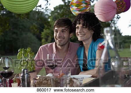 A couple at a dinner party, outdoors View Large Photo Image Stock Photo - A couple at a dinner party, outdoors. Fotosearch