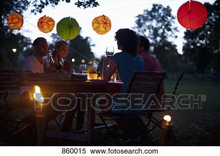Four people at a dinner party View Large Photo Image Stock Photography - Four people at a dinner party. Fotosearch