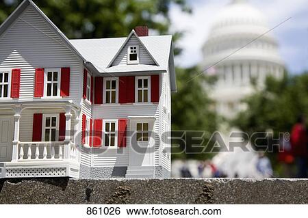 Stock Photograph - Detail of a white model house in front of the United States Capitol Building, Washington DC, USA. Fotosearch