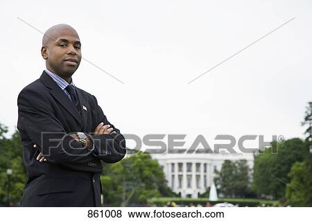Portrait of a man standing in front of the White House, Washington DC, USA View Large Photo Image Stock Photo - Portrait of a man standing in front of the White House, Washington DC, USA. Fotosearch
