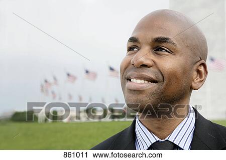 Portrait of a well dressed man smiling and looking away, Washington DC, USA View Large Photo Image Stock Image - Portrait of a well dressed man smiling and looking away, Washington DC, USA. Fotosearch