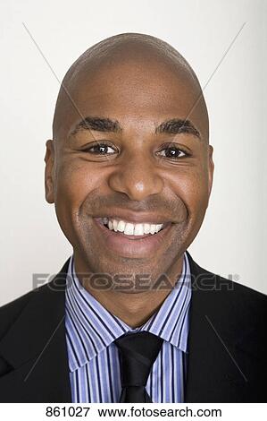 Portrait of a well dressed man smiling View Large Photo Image Stock Photo - Portrait of a well dressed man smiling. Fotosearch