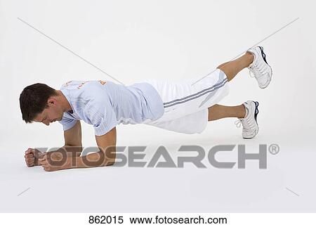 A man doing leg raises View Large Photo Image Stock Photography - A man doing leg raises. Fotosearch
