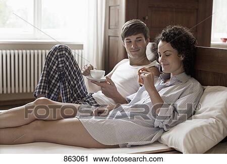 A couple drinking tea in bed together View Large Photo Image Stock Image - A couple drinking tea in bed together. Fotosearch