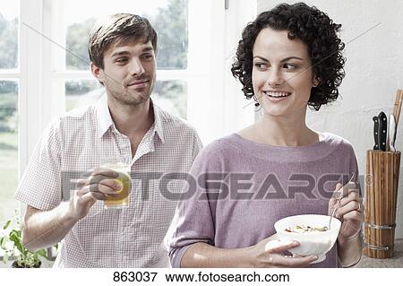 A couple having breakfast in the kitchen View Large Photo Image Stock Photo - A couple having breakfast in the kitchen. Fotosearch