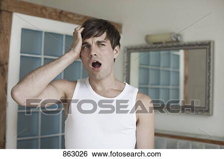 A man yawning in the bathroom View Large Photo Image Stock Photograph - A man yawning in the bathroom. Fotosearch