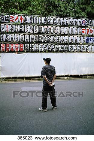 A man looking at an arrangement of paper lanterns, Tokyo, Japan View Large Photo Image Stock Image - A man looking at an arrangement of paper lanterns, Tokyo, Japan. Fotosearch