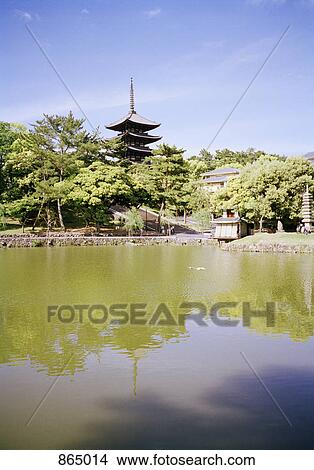Picture - A pagoda temple by a lake, Nara, Japan. Fotosearch