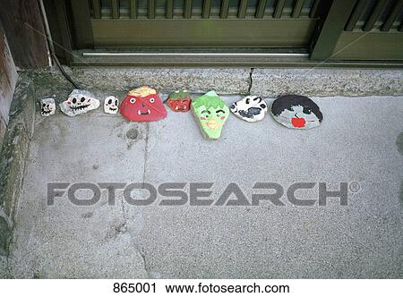 Painted stones on a door step View Large Photo Image Stock Image - Painted stones on a door step. Fotosearch