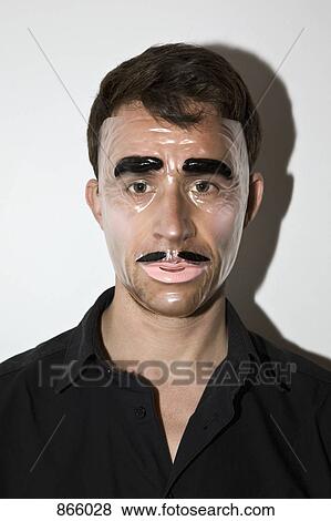 A man wearing a novelty mask View Large Photo Image Stock Photo - A man wearing a novelty mask. Fotosearch