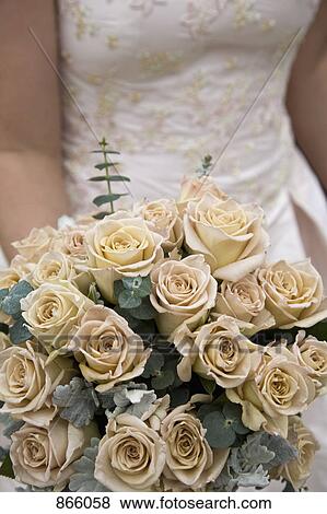 Detail of a bride holding a bouquet View Large Photo Image Stock Photo - Detail of a bride holding a bouquet. Fotosearch