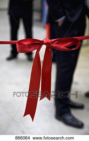 Detail of a red ribbon barrier View Large Photo Image Picture - Detail of a red ribbon barrier. Fotosearch