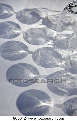 shadows and reflections of wine glasses on a table View Large Photo Image Stock Image - shadows and reflections of wine glasses on a table. Fotosearch