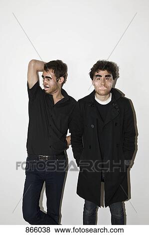 Stock Photo - Two men posing in novelty masks. Fotosearch