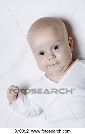 Stock Image - A baby making a face. Fotosearch