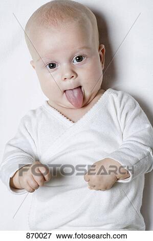 A baby sticking out her tongue, portrait View Large Photo Image Stock Photo - A baby sticking out her tongue, portrait. Fotosearch