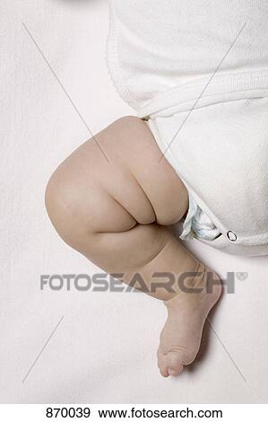 Stock Photo - A baby's bare foot and leg. Fotosearch