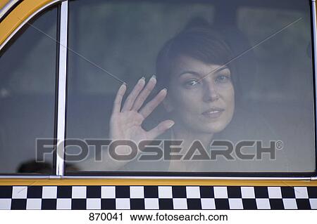 A sad woman in a taxi with her palm against the window View Large Photo Image Stock Image - A sad woman in a taxi with her palm against the window. Fotosearch